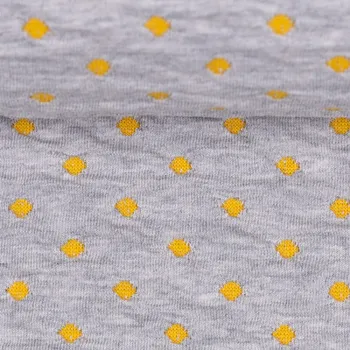 Bavlněný úplet plastický – žluté puntíčky na šedé