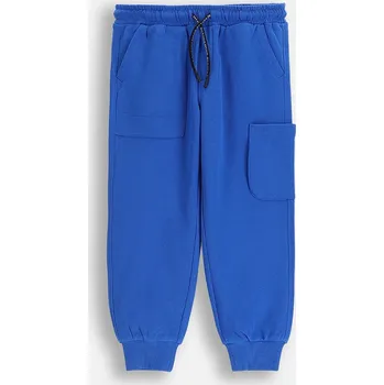 Chlapecké kalhoty Dětské tepláky s bavlnou Coccodrillo ZC5120201CBK modrá 57X, vel. 122