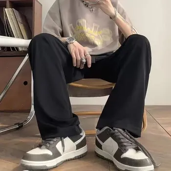 Pánské kalhoty Pánské kalhoty s puky – zúžený střih, ležérní styl Velikost: XL, Barva (Varianta): JQ105-BLACK