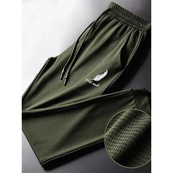 Pánské sportovní kalhoty – lehké, rychleschnoucí, na běh Velikost: L, Barva (Varianta): Zelená