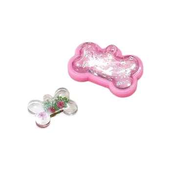 Růžová silikonová forma Kost 4,7 x 3,5 cm na odlévání z pryskyřice Výroba přívěsků klíčenek dekorací a originálních doplňků