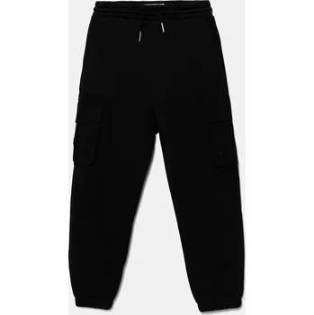 Dětské bavlněné tepláky Calvin Klein Jeans IB0IB02572.9BYA černá 99X, vel. 170