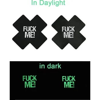 Erotická ozdoba SuperLove Glow in the Dark Cross Nipple Covers Fuck Me! Black