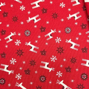 Rumitex Bavlněná látka, cena za 1 metr, šíře 150 cm, JELENI NA ČERVENÉM S VLOČKAMI