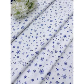 Látka 100% bavlna - modré vločky na bílé