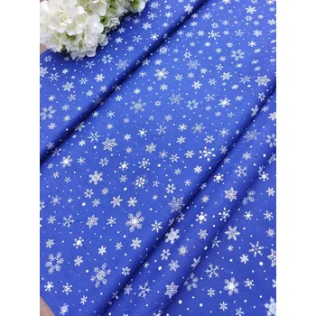 Látka 100% bavlna - bílé vločky na modré