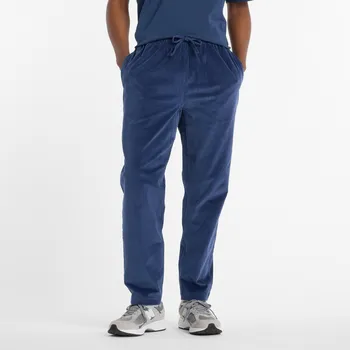Pánské kalhoty Pánské kalhoty New Balance MP53521NNY – tmavomodrá