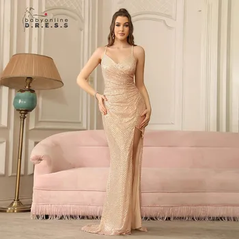 Dámské šaty Dlouhé flitrované šaty s rozparkem a šněrováním na otevřených zádech Barva: Zlatá, Velikost: L