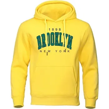 Pánská mikina Pánská mikina s kapucí a kapsami Jednobarevná sportovní mikina s jemným nápisem Brooklyn na hrudi Pohodlný polyesterový materiál žlutá XS
