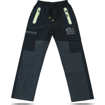 xcena Šusťákové tepláky vyteplené s kapsami Velikost: 146