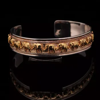 Náramek Stříbrný pevný náramek se slony Ag 25,2 g dekorovaný pozlacením