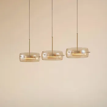 Lucande LED závěsné světlo Martis, jantarová, 3 žárovky, stmívatelné - Stropní držák – délka 70 cm, šířka 8,5 cm, výška 3,5 cm černá, mosaz, jantarová LED 35 W celkem - Doprava zdarma