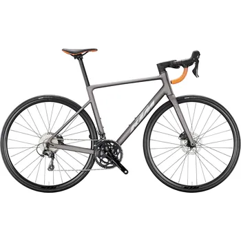 Silniční kolo Silniční kolo KTM REVELATOR 15 2026 MOON ROCK MATT (SILVER+ORANGE GLOSSY) Barva: Šedá, Velikost: S lehký hliníkový rám s komponenty Shimano Tiagra, ideální pro závodní i sportovní ježdění s 10st. převody