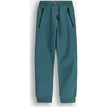 Chlapecké kalhoty Dětské tepláky Coccodrillo ZC5120201CBJ tyrkysová 67X, vel. 134