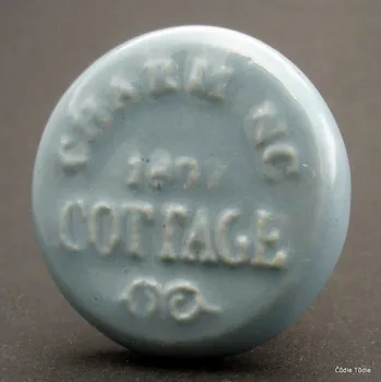 Nábytkové kování Nábytková úchytka šedá s reliéfní kresbou 4,2 cm - knopka