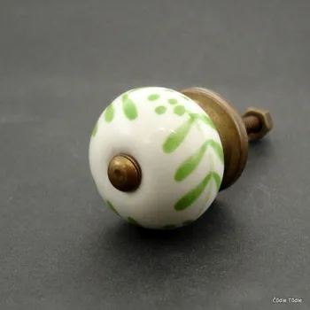 Nábytkové kování Nábytková úchytka bílá se světle zeleným ornamentem 3 cm - knopka