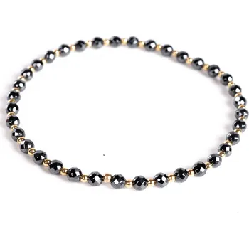 Náramek 7 Angelic Eyes Hematitový náramek se 14 kt zlatými kuličkami Délka: 17 cm