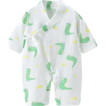 Kojenecký overall Mušelínový bavlněný overal pro novorozence s dlouhým rukávem a výstřihem do V Bílý unisex overal s motivem zelených dinosaurů a šněrovacími rozparky 9-12 měsíců