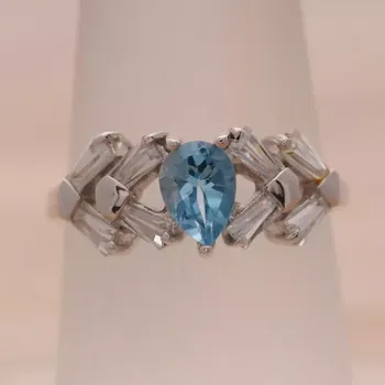Prsten Stříbrný prsten se sky blue topazem a kubickými zirkony Ag 3,2 g 58