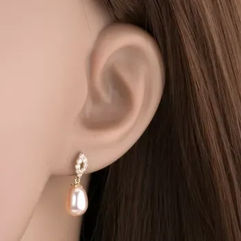 Náušnice Náušnice ze žlutého 14K zlata - třpytivý obrys zrnka, oválná perla