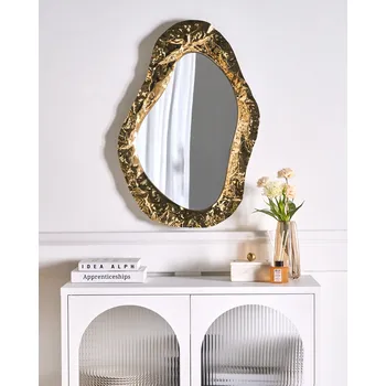 Zrcadlo Nástěnné zrcadlo zlaté MDF nerezový asymetrický rám v industriálním glamour stylu dekorativní nástěnný doplněk Beliani