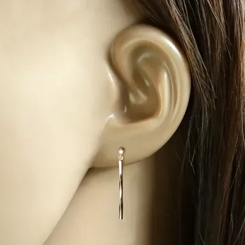 Náušnice Náušnice ze 14K žlutého zlata - tenká spirálovitě zatočená tyčinka, čirý briliant