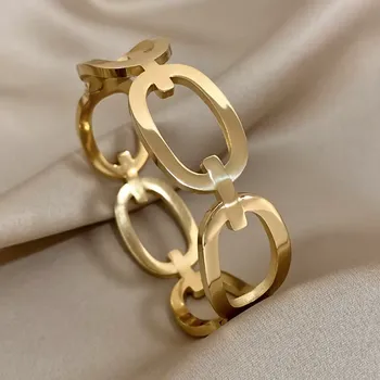 Náramek B-TOP Pevný dámský náramek z pozlacené nerezové oceli s velkými oky