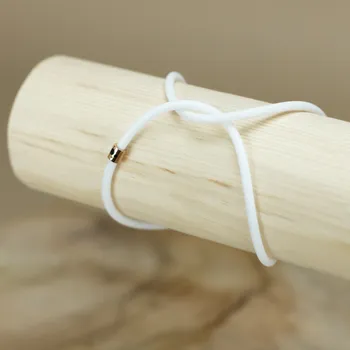 Náramek Nekonečný náramek klasik bílý - připínací Velikost náramku: S : 15- 16 cm, Barva korálku (logo): rosegold