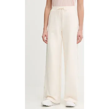 Tepláky Guess OCTAVIA dámské, béžová barva, s aplikací, V5BB12 KCX22 V5BB12.KCX22 01X, vel. XS