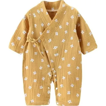 Kojenecký overall Mušelínový bavlněný overal pro novorozence s dlouhým rukávem a výstřihem do V Žlutý unisex overal s motivem pejsků a šněrovacími rozparky 3-6 měsíců