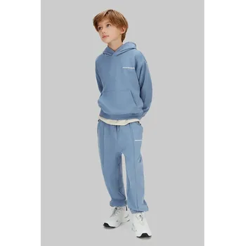 Chlapecké kalhoty Dětské bavlněné tepláky Calvin Klein Jeans IB0IB02605.128.176.PPY2 modrá 50X, vel. 164