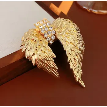 Brož B-TOP Pozlacená brož ve tvaru andělských křídel s krystaly