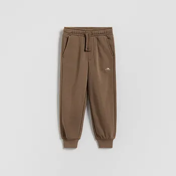 Dětská móda Reserved - Bavlněné jogger kalhoty - hnědá - 474HK-88X - 474HK-88X-80