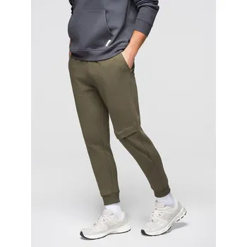 Pánské tepláky s prošíváním a zipem na nohavicích - olivové V3 OM-PASK-0147 - XXL