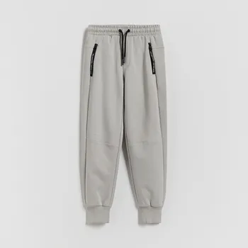 Dětská móda Reserved - Bavlněné jogger kalhoty - světle šedá - 403HK-09X - 403HK-09X-140