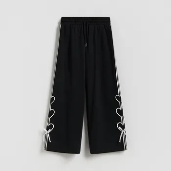 Dívčí oblečení Reserved - Tepláky s&nbsp;ozdobnými mašlemi - černý - 117HN-99X - 117HN-99X-116