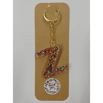 Přívěsek na klíče z pryskyřice - písmeno "Z" čirý, červené třpytky