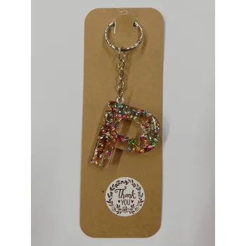 Přívěsek na klíče z pryskyřice - písmeno "P" čirý, červené třpytky