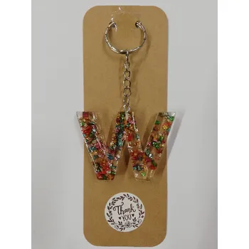 Přívěsek na klíče z pryskyřice - písmeno "W" čirý, červené třpytky