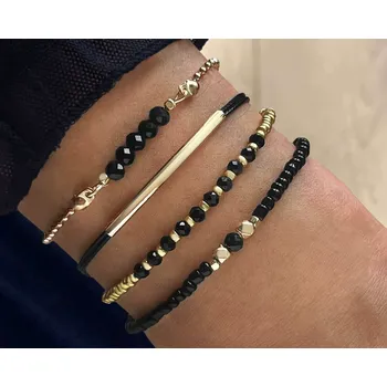 Náramek B-TOP Sada 4 dámských náramků v černé kombinaci Druh barvy: Zlatá