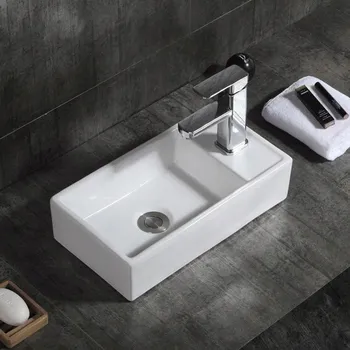 Bílé umyvadlo na desku 40x22cm