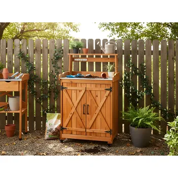 Zahradní stůl Zaharadní stůl s úložným prostorem na přesazování světle hnědé jedlové dřevo 74 x 40 x 119 cm pozinkovaná železná pracovní deska s kolečky moderní Beliani