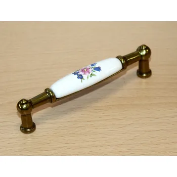 Nábytkové kování 11018 úchytka rozteč 96mm mosaz - porcelánový kytka (Úchytka kombinující lesklou mosaz a porcelánovou vložku s květinovým motivem. Rozteč 96mm. Tradiční a nadčasový vzhled pro kuchyně a nábytek.)