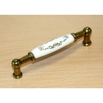Nábytkové kování 11020 úchytka rozteč 96mm mosaz - porcelánový ornament (Nábytková úchytka s roztečí 96 mm v povrchu mosaz. Vhodné řešení pro nábytek v interiéru.)