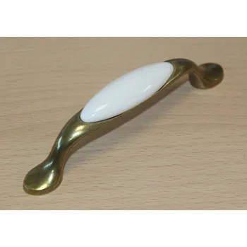 Nábytkové kování 11062 - úchyt 96mm mosaz - porcelánový béžový (11062 - úchyt 96mm mosaz - porcelánový béžový v povrchu mosaz. Praktický doplněk do interiéru.)