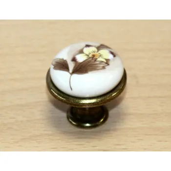 Nábytkové kování 11051 knopka 29mm mosaz - porcelánový MLK7 (Kulatá knopka kombinující lesklou mosaz a bílý porcelán s konkrétním dekorem MLK7. Průměr 29mm, honosný a designový vzhled.)