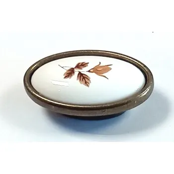 Nábytkové kování 91462 knopka porcelán 33x57 podzim staromosaz (Nábytková knopka v povrchu mosaz. Vhodné řešení pro nábytek v interiéru.)