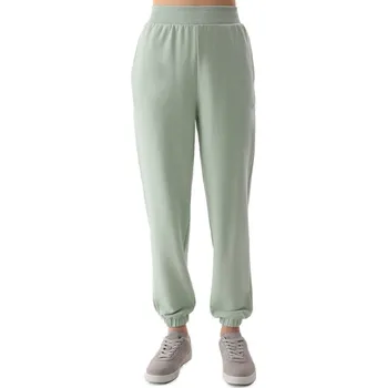Dámské tepláky 4F-TROUSERS-4FWSS24TTROF666-42S-LIGHT GREEN Zelená M