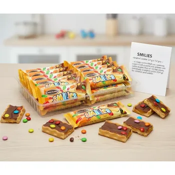 Čokoládová tyčinka SMILIES sušenka s karamelem 27 g x 12 ks – křupavá sušenka v čokoládě s karamelovým krémem (Křupavá sušenka s karamelovým krémem ( 26%) s mléčnou čokoládou ( 18%) a dražé z mléčné čokolády v cukrové polevě ( 5 %))