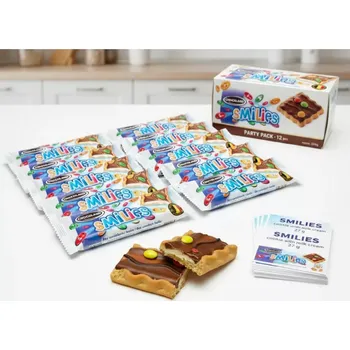 Čokoládová tyčinka SMILIES sušenka s mléčným krémem 27 g x 12 ks – křupavá sušenka v mléčné čokoládě (Křupavá sušenka s mléčným krémem ( 27%) s mléčnou čokoládou ( 16%) a dražé z mléčné čokolády v cukrové polevě (5%))